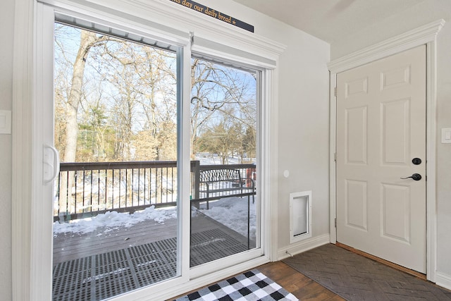 doorway with dark wood-type flooring