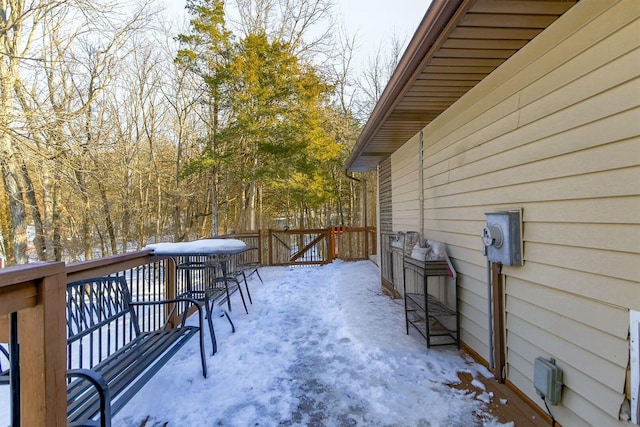 view of snow covered deck