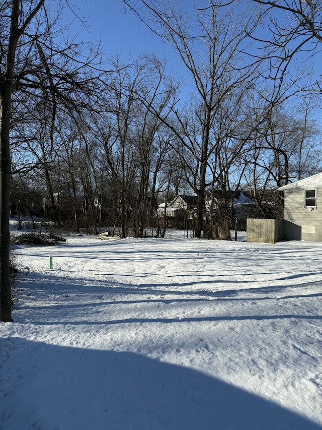 view of yard layered in snow