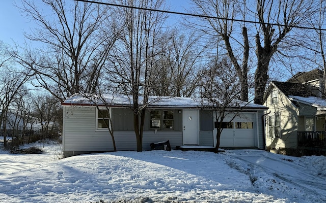 single story home with a garage