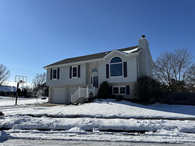 raised ranch featuring a garage