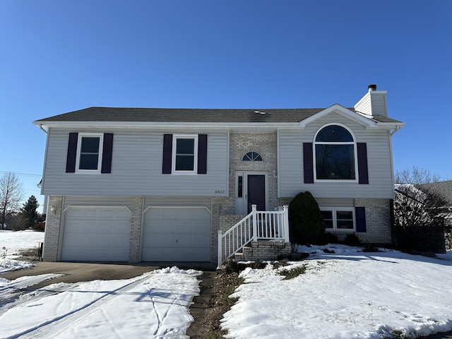 split foyer home featuring a garage