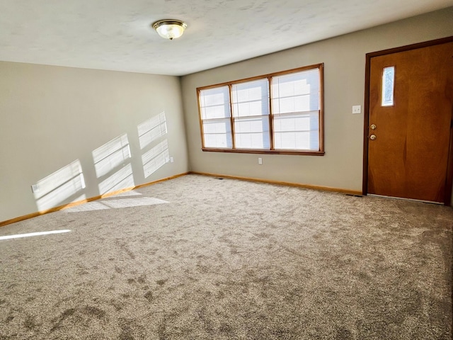 view of carpeted foyer