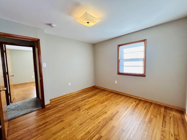 spare room with light hardwood / wood-style floors