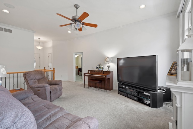 living room with ceiling fan, crown molding, and carpet floors