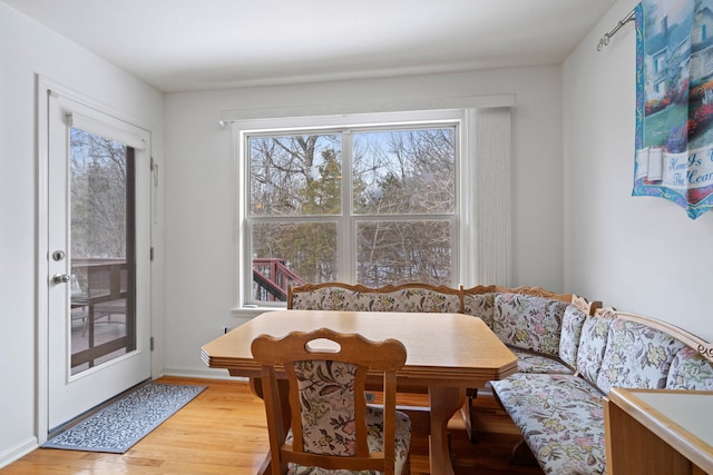 dining space with hardwood / wood-style floors