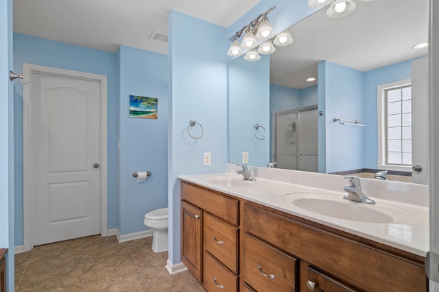 bathroom featuring a stall shower, visible vents, a sink, and double vanity