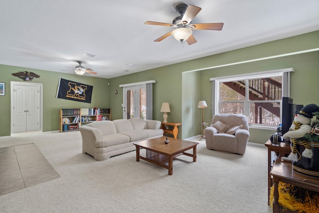 carpeted living room featuring ceiling fan