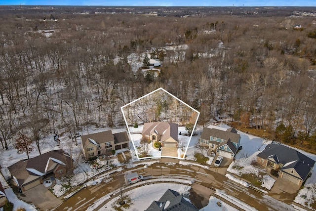 snowy aerial view featuring a residential view