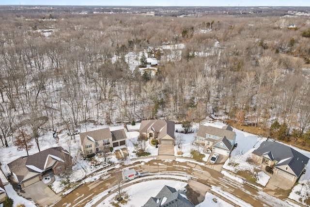 snowy aerial view with a residential view