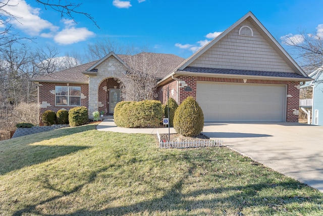 view of front of property with brick siding, an attached garage, a front yard, stone siding, and driveway