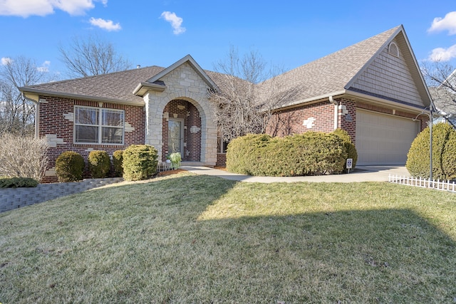 view of front of house with driveway, a shingled roof, a front lawn, and brick siding