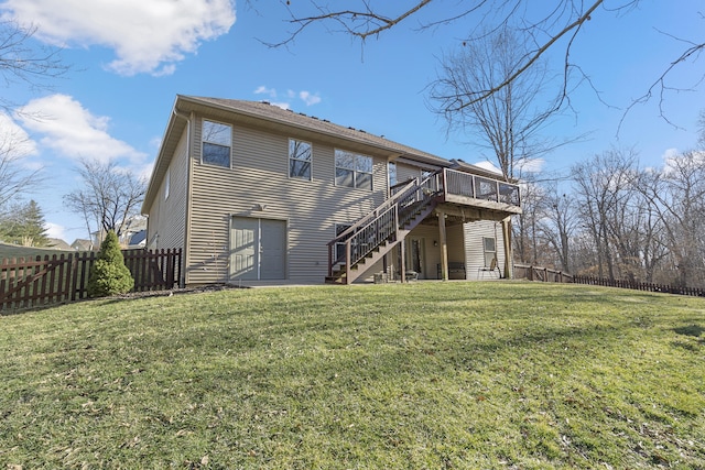 rear view of property featuring a fenced backyard, a yard, a wooden deck, and stairs