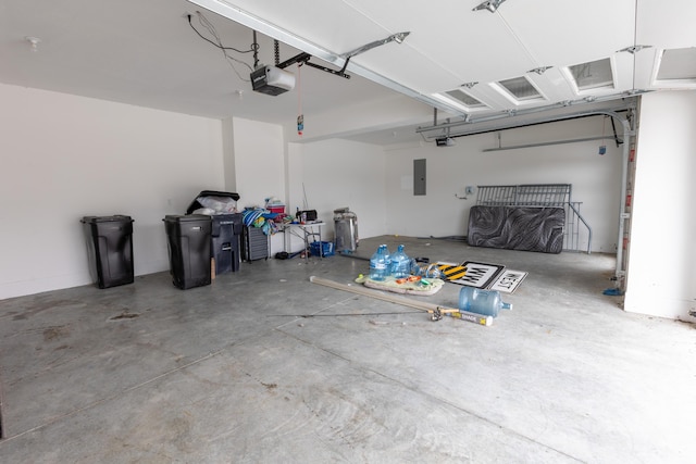 garage featuring electric panel and a garage door opener