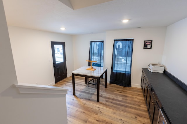 office with light hardwood / wood-style flooring