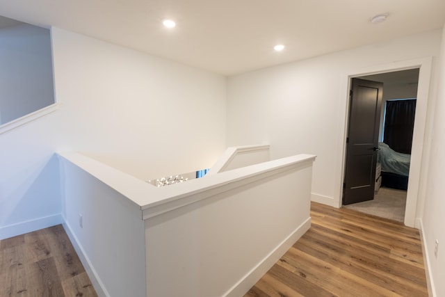 corridor featuring hardwood / wood-style flooring