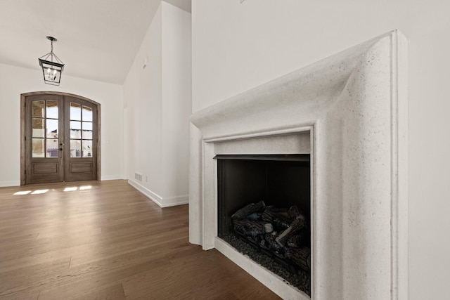 foyer entrance featuring dark hardwood / wood-style flooring and french doors