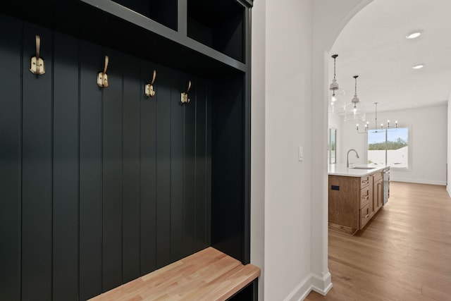 mudroom featuring light hardwood / wood-style floors and sink