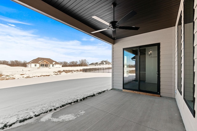 snow covered patio with ceiling fan