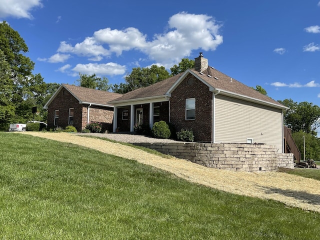 view of property exterior with a yard