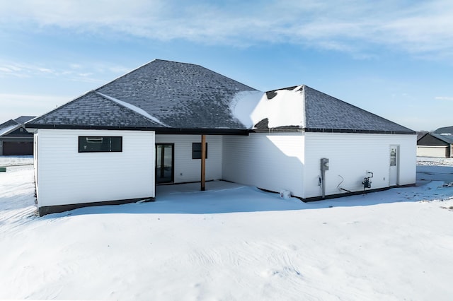 view of snow covered house