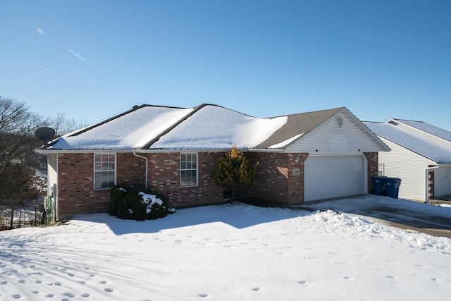 ranch-style house featuring a garage