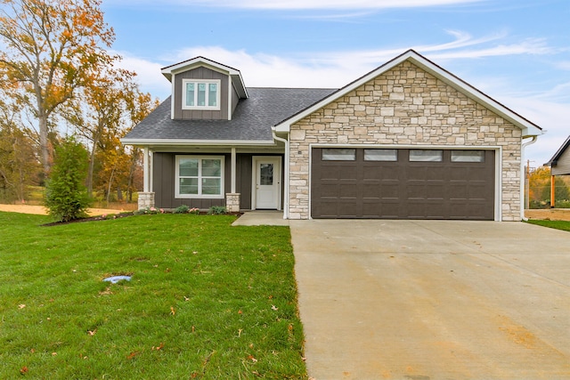 view of front facade featuring board and batten siding, a garage, driveway, and a front lawn