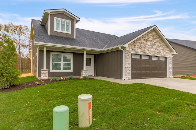 craftsman inspired home featuring roof with shingles, concrete driveway, an attached garage, board and batten siding, and a front yard