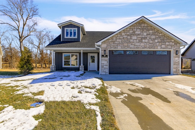 view of front facade featuring driveway, stone siding, a garage, and board and batten siding