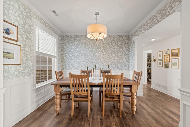 dining area featuring crown molding and dark hardwood / wood-style flooring