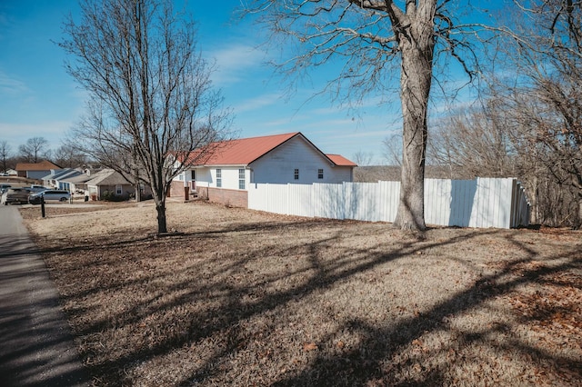 view of property exterior with a yard