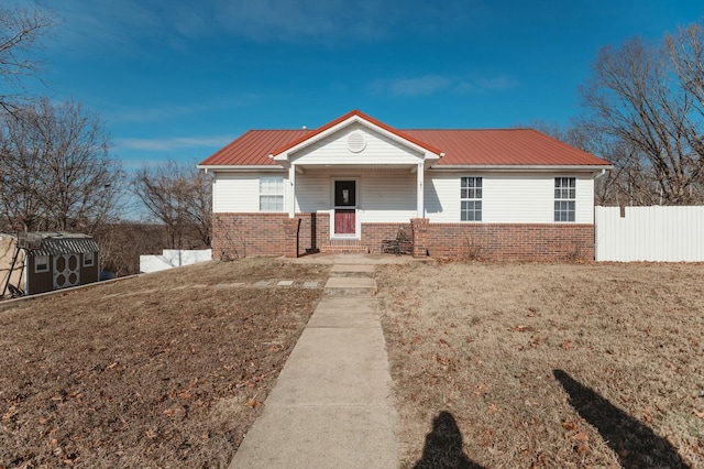 ranch-style home with a front lawn