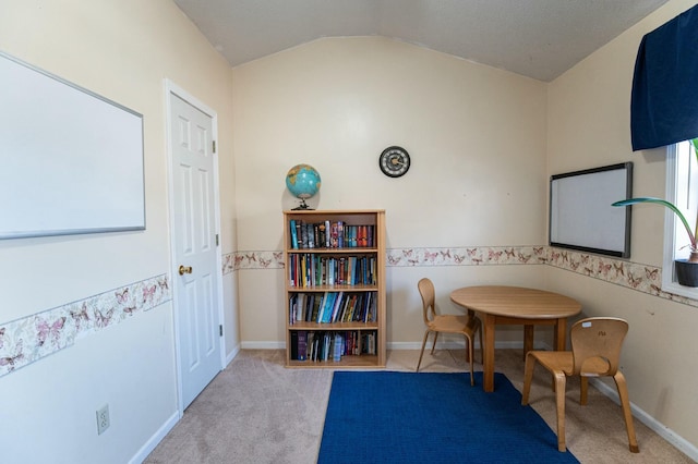 game room with vaulted ceiling and light colored carpet