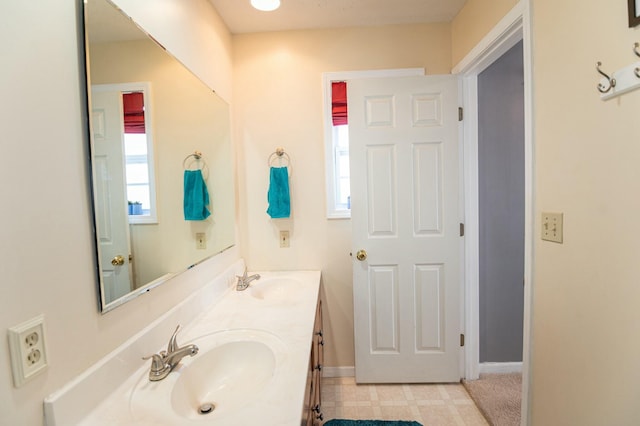 bathroom featuring a healthy amount of sunlight and vanity