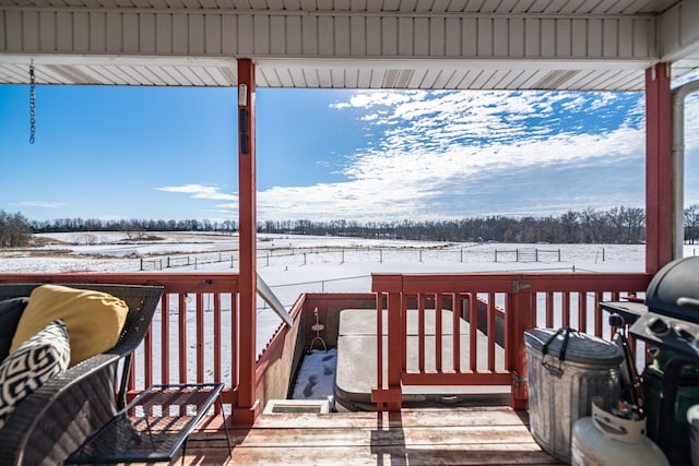 view of snow covered deck