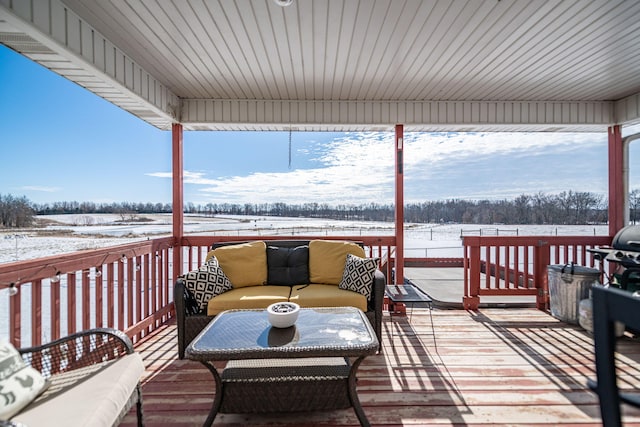 view of snow covered deck