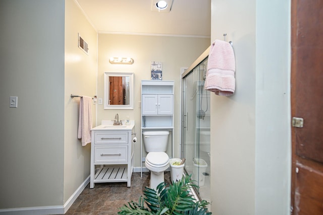 bathroom with vanity, toilet, and an enclosed shower