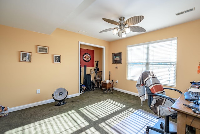 carpeted office featuring ceiling fan and plenty of natural light