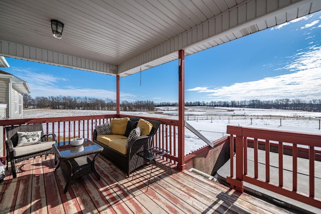 snow covered deck with an outdoor hangout area