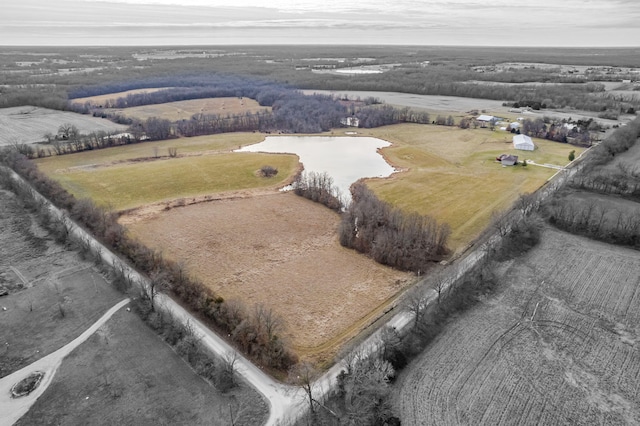 drone / aerial view with a water view and a rural view