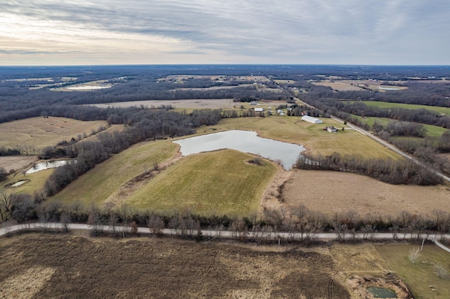 birds eye view of property with a water view and a rural view