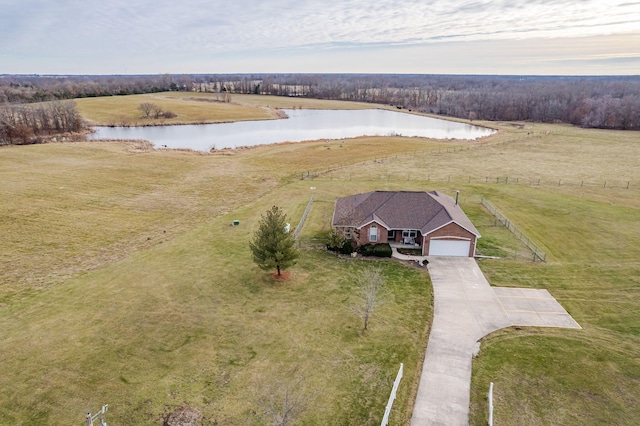 birds eye view of property featuring a water view and a rural view