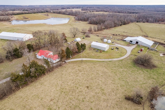 drone / aerial view featuring a water view and a rural view