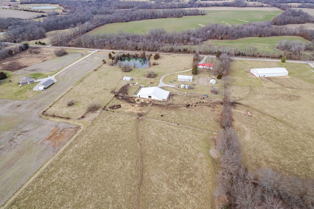 birds eye view of property with a rural view