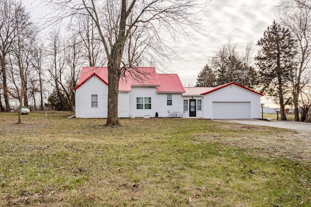 view of front of house with a garage and a front yard