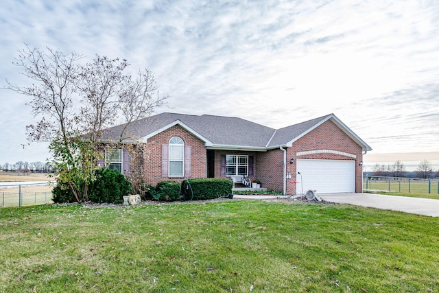 ranch-style house with a garage and a front yard