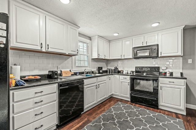 kitchen featuring sink, white cabinets, dark hardwood / wood-style flooring, and black appliances