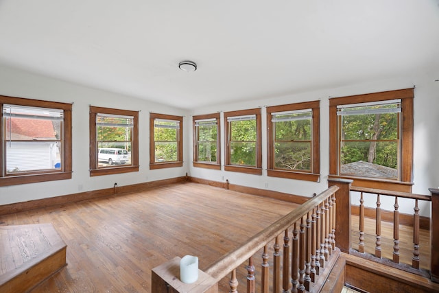 interior space featuring lofted ceiling and wood-type flooring