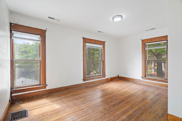 unfurnished room featuring light hardwood / wood-style flooring