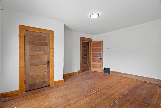 unfurnished room with light hardwood / wood-style floors